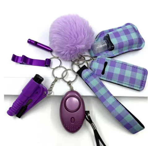 Keychain set with purple and checkered accessories on a white background
